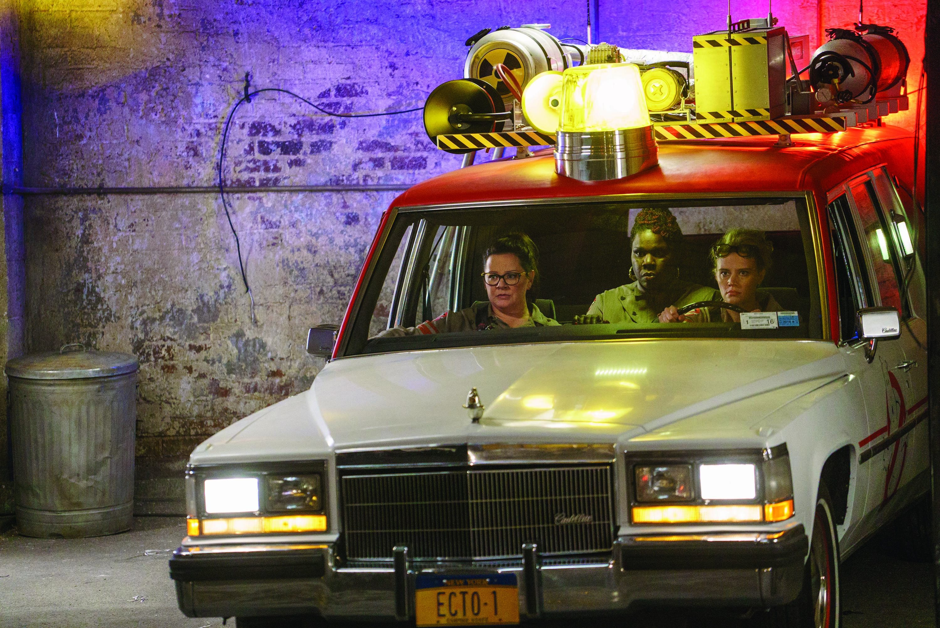 Ghostbusters Abby (Melissa McCarthy), Patty (Leslie Jones) and Holtzmann (Kate McKinnon) in the Ecto-1 in Columbia Pictures' GHOSTBUSTERS.